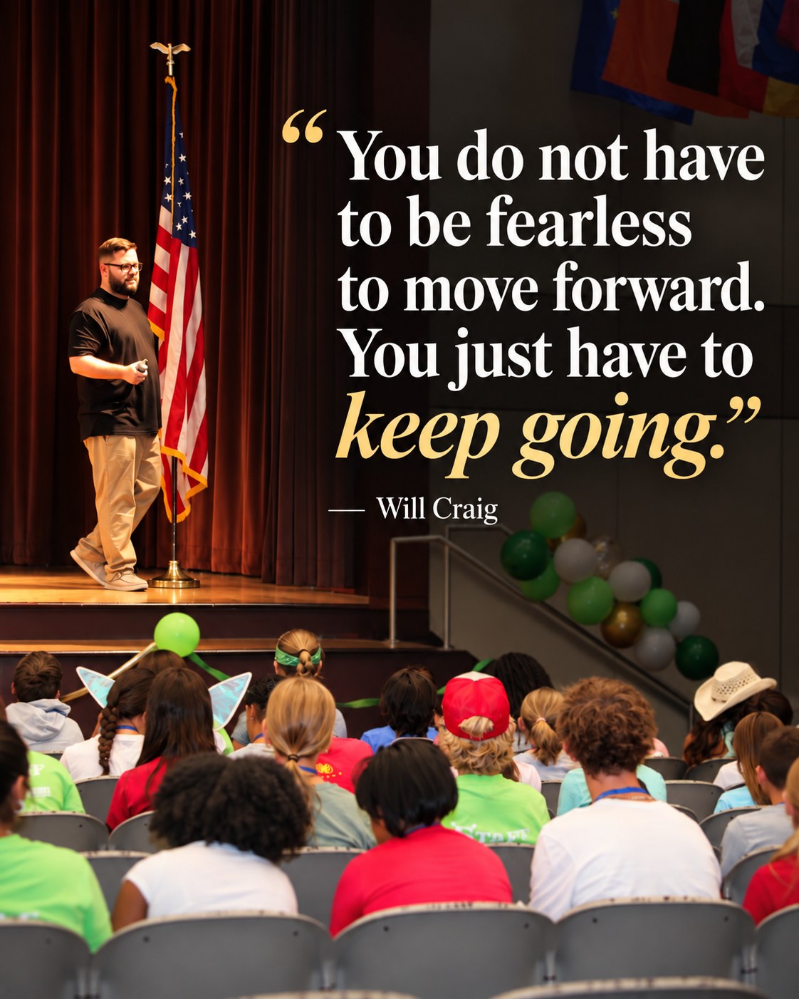 Will Craig on stage at a school assembly with the quote: You do not have to be fearless to move forward. You just have to keep going.